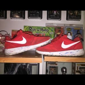 Nike Roshes solar red with multi color sole. Used